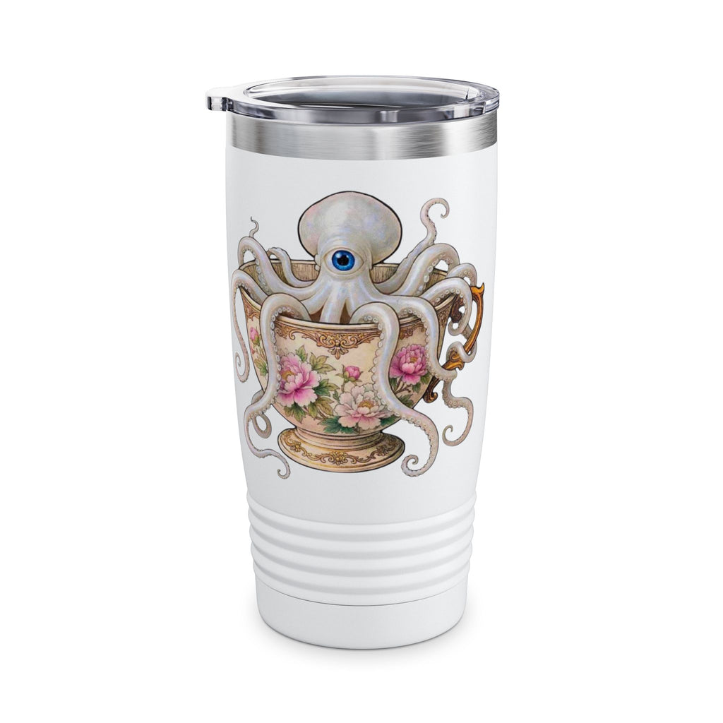 A white insulated travel tumbler with a stainless steel lid, featuring a whimsical graphic of a white octopus with a blue eye wrapping around a floral teacup. this image looks like it came from a magic  cottage
