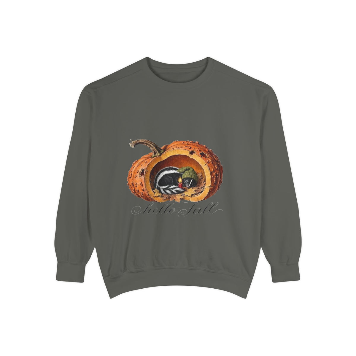 A dark gray crewneck sweatshirt featuring a graphic of a carved orange pumpkin with a black and white striped skunk inside, and the cursive text 'Hello Fall  printed below. Discover this whimsical, seasonal cottage core pullover in vintage Victorian bookplate style